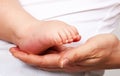 Baby foot in mother hand Royalty Free Stock Photo