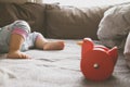 Baby foot and red toy on the bed Royalty Free Stock Photo