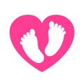 Baby footprints in heart icon - Royalty Free Stock Photo