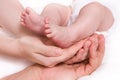 Baby foots in hands of parents Royalty Free Stock Photo