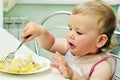 Baby with fork Royalty Free Stock Photo