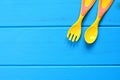 Baby fork and spoon on a wooden background