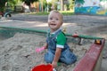 Baby fun playing with sand