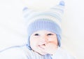 Baby in a funny blue hat on white background Royalty Free Stock Photo