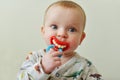 Baby with funny dummy Royalty Free Stock Photo