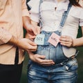 Baby gender. Mom and dad with BOY and GIRL cards