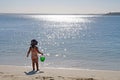 A baby girl admiring the ocean view and sun reflection on the water, Sydney, Australia Royalty Free Stock Photo