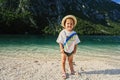 Baby girl against Lake Bohinj, the largest lake in Slovenia, part of Triglav National Park Royalty Free Stock Photo