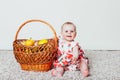 Baby girl with a basket of Green apples Royalty Free Stock Photo