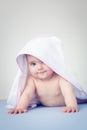 Baby girl after bath with a towel on her head in consideration. Royalty Free Stock Photo