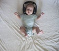 Baby girl in big headphones Royalty Free Stock Photo