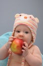 Baby girl bite organic apple Royalty Free Stock Photo