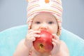 Baby girl bite organic apple Royalty Free Stock Photo