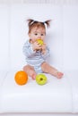 Baby girl biting an apple Royalty Free Stock Photo