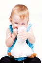 Baby girl biting her toy Royalty Free Stock Photo