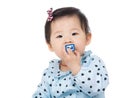 Baby girl biting toy block Royalty Free Stock Photo