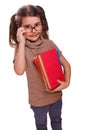 Baby girl brunette glasses reads the book keeps smiling isolated