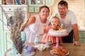 Baby girl with a cake in kitchen at home. family home two years birthday. Royalty Free Stock Photo