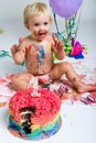 Baby girl celebrating her first bithday with gourmet cake. Royalty Free Stock Photo