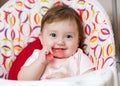 Baby girl chewing on teething toy. First teeth. Royalty Free Stock Photo