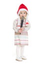 Baby girl in Christmas hat using microphone Royalty Free Stock Photo