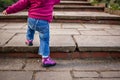 Baby girl climbing steps