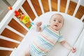 Baby girl in co-sleeper crib Royalty Free Stock Photo