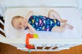 Baby girl in co-sleeper crib Royalty Free Stock Photo