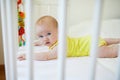 Baby girl in co-sleeper crib