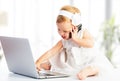 Baby girl with computer laptop, mobile phone Royalty Free Stock Photo