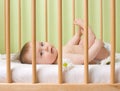 Baby girl in a crib Royalty Free Stock Photo