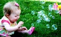 Baby girl crying with bubbles