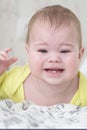 Baby girl crying teething. Baby upset because of toothache. Portrait of baby child close-up soft focus Royalty Free Stock Photo