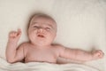 Baby girl with cute facial expression, pointing finger and one arm stretched out. Royalty Free Stock Photo