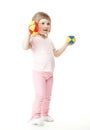 Baby girl doing exercises with toy dumbbells Royalty Free Stock Photo
