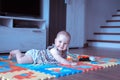 Baby girl doing tummy time on colorful play mat Royalty Free Stock Photo