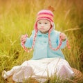 Baby girl with Down syndrome looks surprised Royalty Free Stock Photo