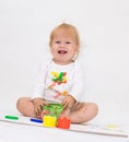 Baby girl drawing picture with paints Royalty Free Stock Photo