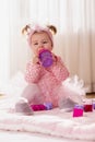 Baby girl drinking water from a bottle Royalty Free Stock Photo