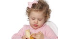 Baby girl eating fruit Royalty Free Stock Photo