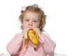 Baby girl eating fruit Royalty Free Stock Photo