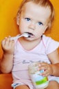 Baby girl eating puree Royalty Free Stock Photo