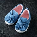 Baby girl first blue denim shoes with bow Royalty Free Stock Photo