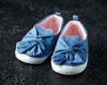 Baby girl first blue denim shoes with bow Royalty Free Stock Photo