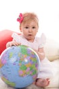 Baby girl with globe Royalty Free Stock Photo