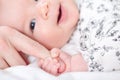 Baby girl grasping her parents finger Royalty Free Stock Photo