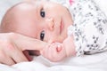 Baby girl grasping her parents finger Royalty Free Stock Photo