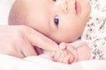 Baby girl grasping her parents finger Royalty Free Stock Photo