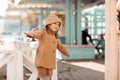 Baby girl has fun and plays on a sunny autumn day in the playground in a public park Royalty Free Stock Photo