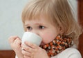 The baby girl has tea Royalty Free Stock Photo